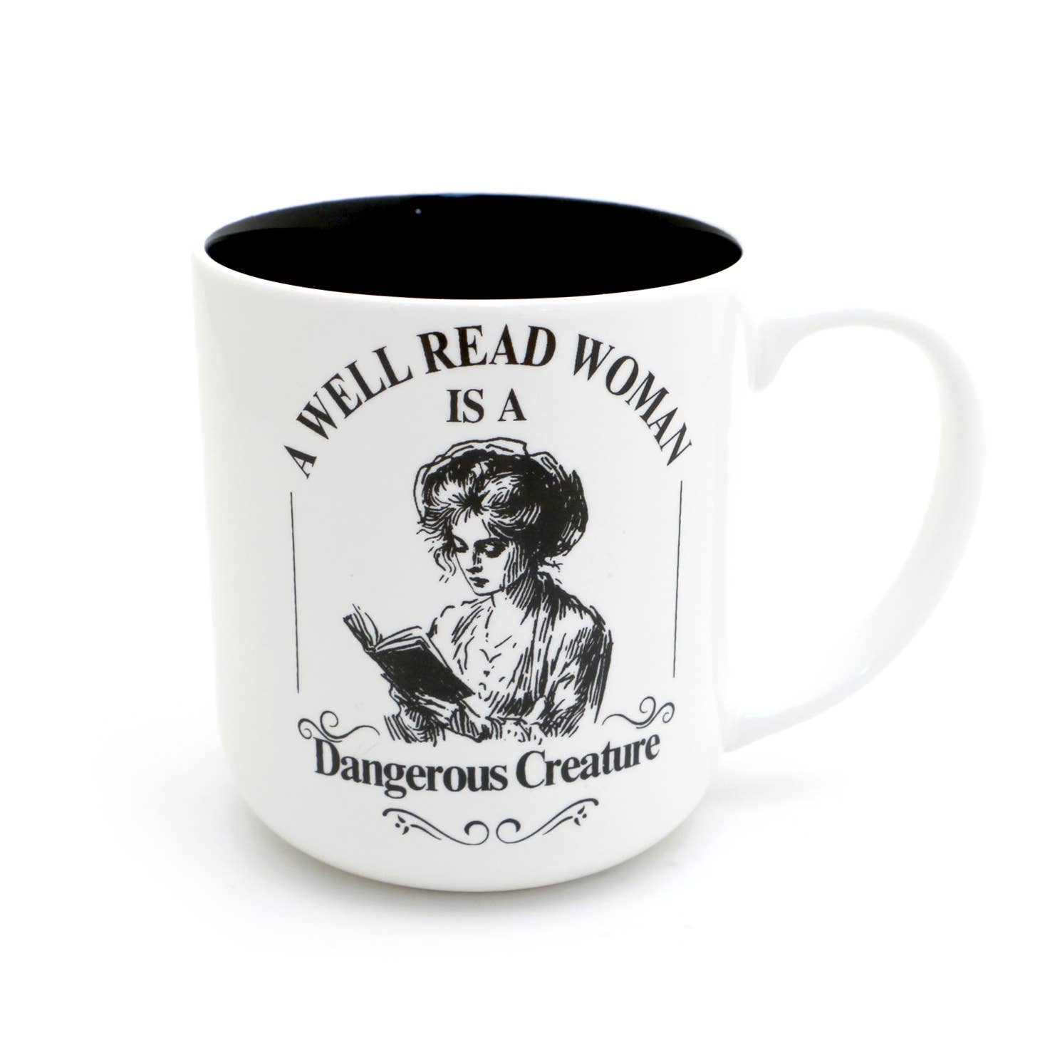 White mug with black interior, featuring an illustration of a woman reading a book and text 'A Well Read Woman is a Dangerous Creature' on a white background.