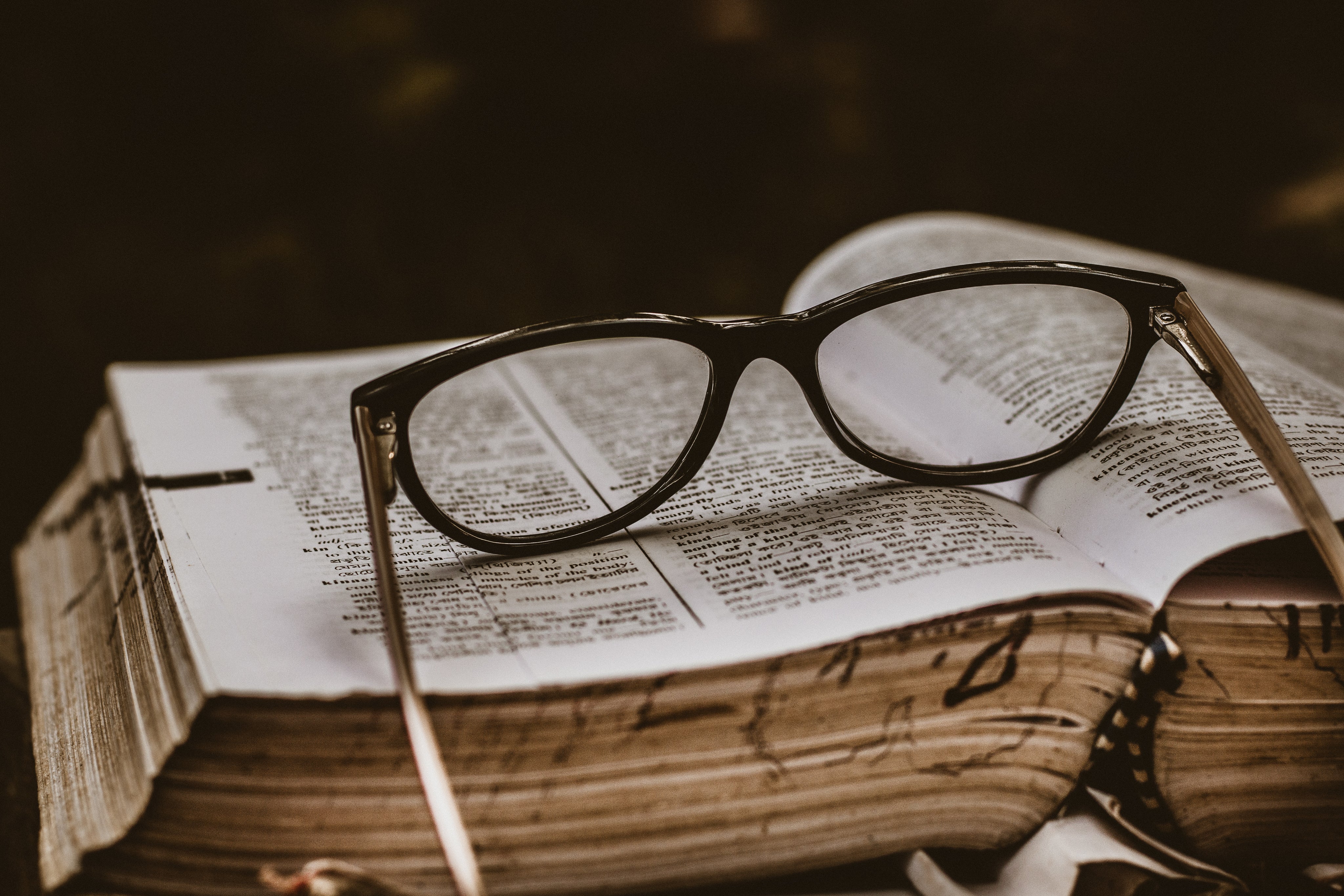 black-spectacles-otop-an-open-book.jpg